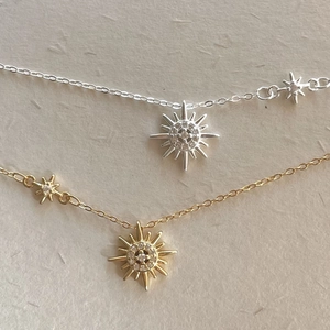 Elegant 925 sterling silver sunburst star pendant necklace with cubic zirconia in gold and silver