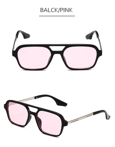 Detail view of retro square aviator sunglasses with black frame and pink lenses