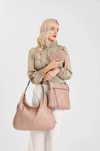 Three-piece retro soft leather tote bag set shown in a model lifestyle presentation