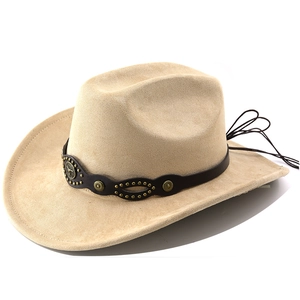 Detail of beige faux suede cowboy hat featuring a leather band with bull head emblem