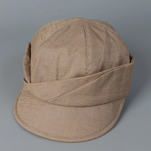 Detailed close-up of breathable linen newsboy hat with crisscross fold design textures