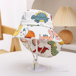 Detail of kids sun hat with colorful cartoon dinosaur prints and adjustable chin strap