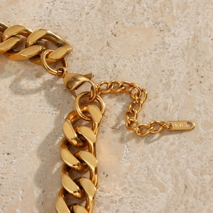 Polished 18K gold Cuban link chain necklace for women featuring a secure lobster clasp