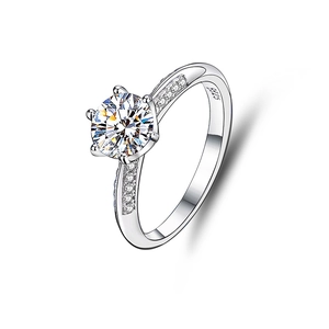 Detail view of S925 sterling silver ring with six-prong moissanite and side accents