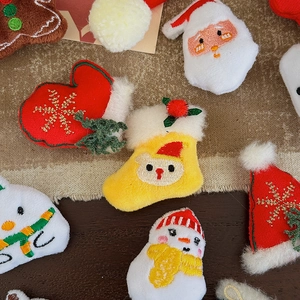 Plush Christmas character patches including Santa and Snowman for DIY holiday crafts