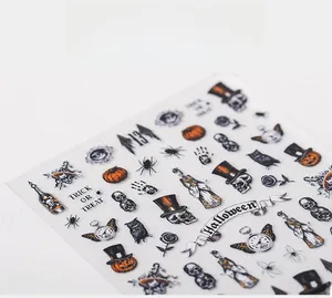 Detail of Halloween nail stickers with skulls, pumpkins and Trick or Treat motifs