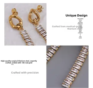 Dettaglio di orecchini a nappa in titanio placcato oro 18K con pietre di zirconia cubica