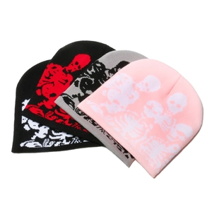 Close-up of skull pattern jacquard beanies in four distinct color combinations