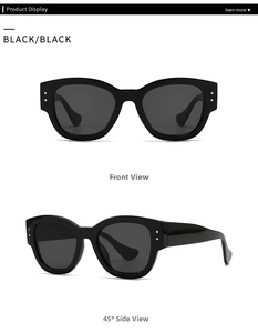 Detail showing classic black square sunglasses with silver double rivets on the frame corner