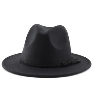 Close-up of black felt fedora hat featuring a woven decorative band and stylish tassels
