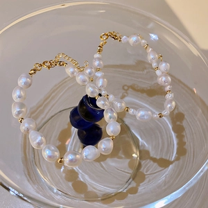 Detail view of Baroque freshwater pearl bracelets with gold-plated adjustable clasps