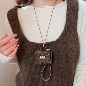 Miniature leopard print bag pendant and earphone case charm worn as a necklace