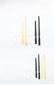 Macro detail of aluminum clock hands in gold, black, and silver finishes for quartz movements