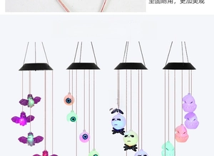 Detail showing four styles of Halloween solar wind chime lights with ghosts and bats