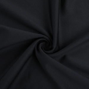 Close-up of premium black knit fabric with spiral texture and elastic weave detail