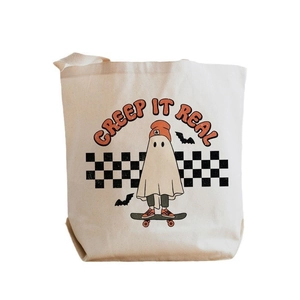 Off-white canvas tote bag featuring Creep It Real ghost and skateboard print for Halloween