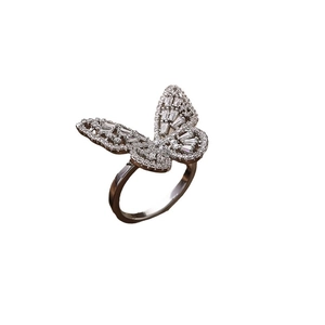 Luminous silver butterfly open ring with sparkling cubic zirconia crystals on white background