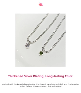 Detail of silver-plated bracelets featuring white and green cubic zirconia in six-claw setting