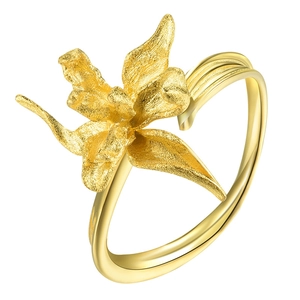 Close-up of golden orchid flower ring with matte texture and adjustable silver band