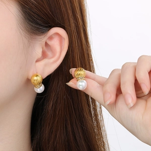 Vintage gold textured stud earrings with white pearl and sparkling zircon accents