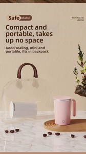 Detail of a portable pink self-stirring coffee mug placed in a transparent tote bag