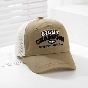 Detail of embroidered Eight Champion 1989 lettering on khaki mesh trucker hat for kids