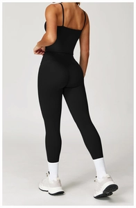 Detail of cross back straps and high-waist fit on black brushed yoga sports bra and leggings