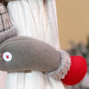 Detailed macro view of the plush fabric texture and stitching on Christmas curtain buckle
