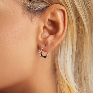 Cute S925 sterling silver dachshund dog hoop earrings on model with golden hair