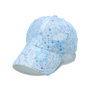 Detail of light blue mesh baseball cap with floral accents and iridescent sequins