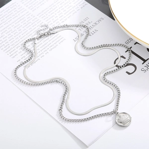 Double-layered silver necklace featuring a flat snake chain and a crown coin pendant
