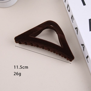 Macro detail of dark brown flocked triangle shark hair clip showing 11.5cm length size