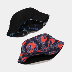 Double-sided bucket hat with marine life patterns in black and navy cotton canvas