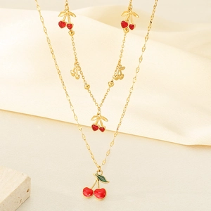 Collier en acier inoxydable plaqué or 18K avec pendentifs cerises rouges sur tissu