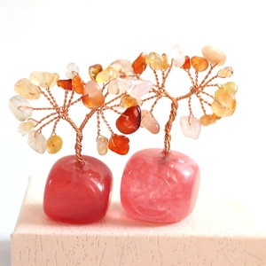 Detailed view of handmade crystal money trees with wire branches and quartz stone base