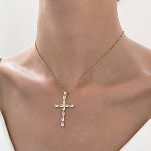 Minimalist gold cross pendant necklace for women featuring sparkling zircon water drop charms
