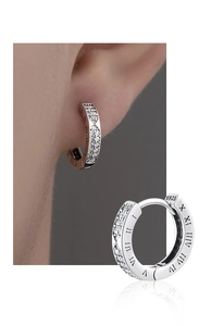 Detail view showing silver hoop earrings with roman numerals and cubic zirconia inlay
