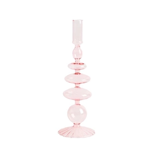 Portacandele artistico in vetro rosa per decorazioni domestiche eleganti su sfondo bianco