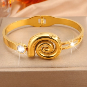 Luxurious gold stainless steel bangle with spiral relief and zircon stone embellishment