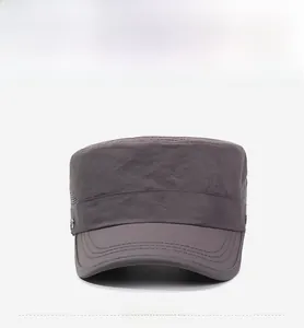 Detail of dark grey cadet cap showing reinforced brim stitching and side metal emblem