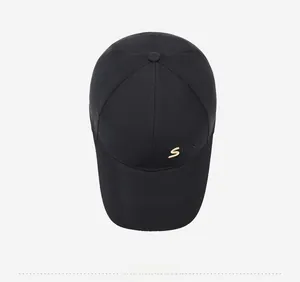 Top-down view of black baseball cap featuring detailed golden letter S embroidery