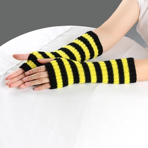 Close-up of yellow and black striped knit fingerless arm warmers on a model