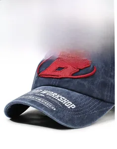 Macro view of washed navy baseball cap with red letter B embroidery and brim details