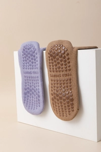 Detailed view of non-slip yoga five-toe socks in lavender and khaki with YOGA SPORTS text