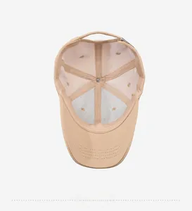 Detail view of khaki baseball cap interior showing breathable mesh and adjustable metal buckle