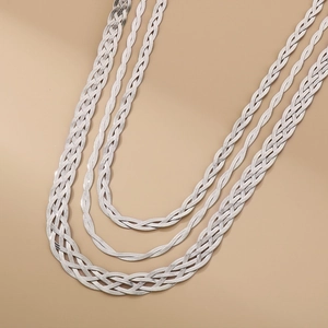 Silver twisted woven snake chain necklace in stainless steel with a layered aesthetic design