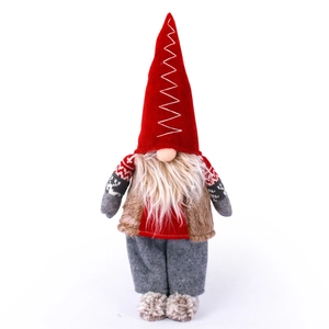 Standing Nordic Christmas gnome doll with tall red hat and white beard on white background
