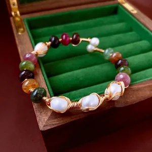 Handcrafted pearl and agate open bangle with gold wire wrapping in bohemian vintage style