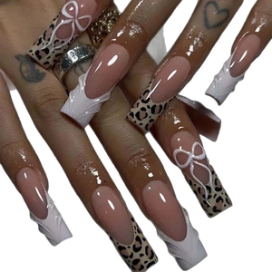 Extra long leopard print press-on nails with 3D white bows and French tip style