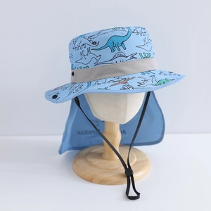 Detail view of light blue dinosaur sun hat with breathable mesh and neck protection flap